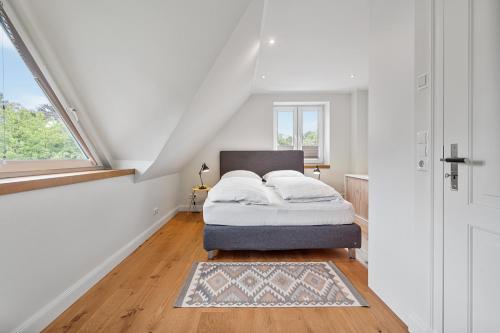 Postel nebo postele na pokoji v ubytování Wellenzeit Ferienhaus Wellenzeit