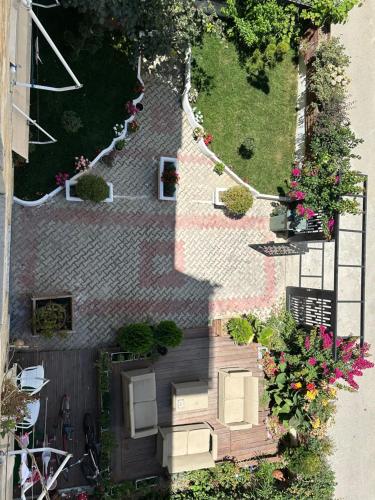an overhead view of a garden with flowers and plants at Vila Zhiti in Durrës