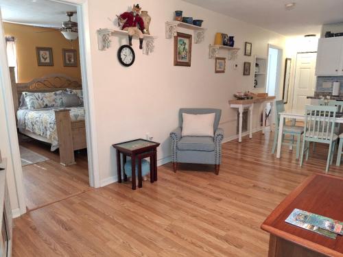 a living room with a bed and a table at The Three Sisters - Pelican Crystal River FL in Crystal River