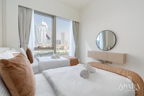 Ένα ή περισσότερα κρεβάτια σε δωμάτιο στο Grande Luxury, Burj Khalifa & Fountain View