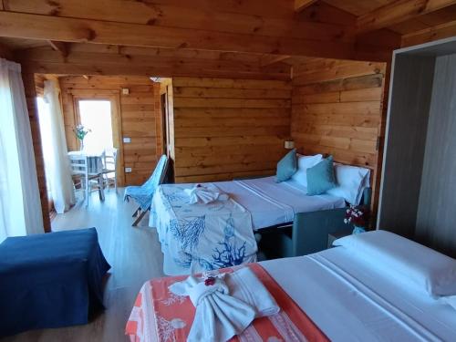 Postel nebo postele na pokoji v ubytování Agriturismo Cinque Tomoli