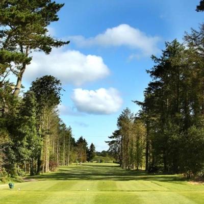 a view of a golf course with trees and a field at Twin Suite On Golf Course Private Cosy in Tramore