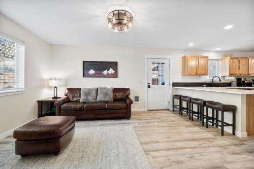 a living room with a couch and a kitchen at Tumalo Ranch home in Tumalo