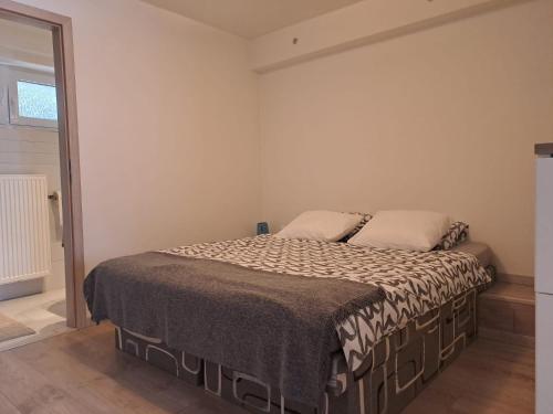 Ένα ή περισσότερα κρεβάτια σε δωμάτιο στο JANA apartments