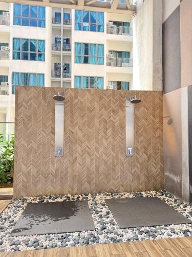 a shower stall in a building with a building in the background at Luxe by KLCC in Gua Sai