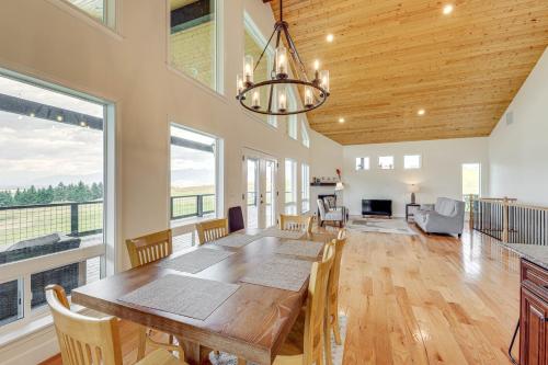 a dining room with a wooden table and chairs at Mountain and Lake View Rexford Estate on 28 Acres! in Rexford