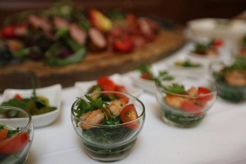 a table topped with bowls of food on a table at Hotel Elefant in Schwerin