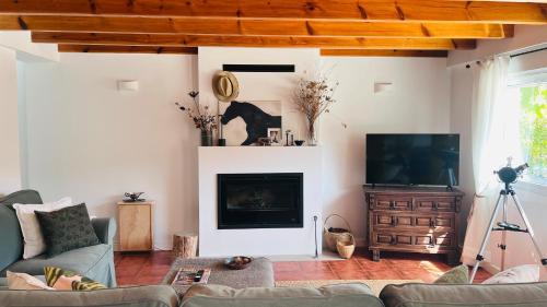 TV a/nebo společenská místnost v ubytování La Casita De La Loma