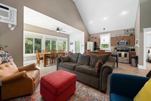 a living room with a couch and a table at The Pronghorn - 97 Butternut in Cherry Valley