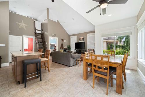 a dining room and living room with a table and chairs at The Pronghorn - 97 Butternut in Cherry Valley