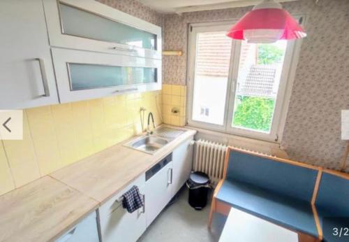 a small kitchen with a sink and a window at HS4 Cozy Unit Kelkheim in Kelkheim