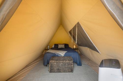 a room with a bed in a tent at On The Lake T03 in Onalaska