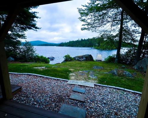 a view of a lake from the inside of a house at Phillips Serenity Retreat in Dedham