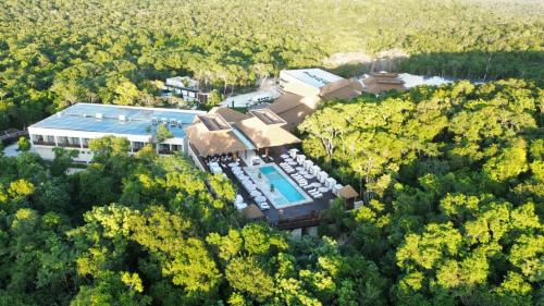 an aerial view of a house with a swimming pool at Hotel Mundo Maya Calakmul in Xpujil