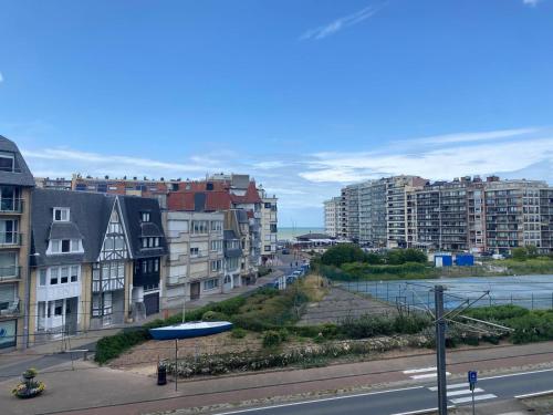 a view of a city with buildings and a street at Studiodevos in Middelkerke