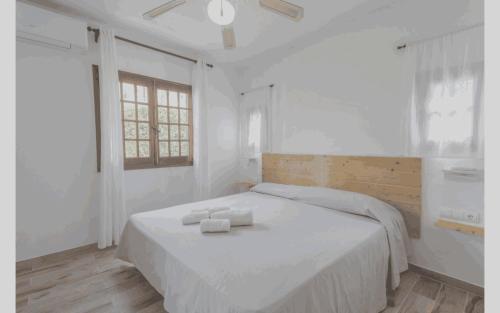 Ένα ή περισσότερα κρεβάτια σε δωμάτιο στο Modern Seaside Apartment in Menorca