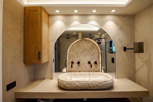 a bathroom with a large bath tub in a room at Anar Luxury Villas in Kalamaki