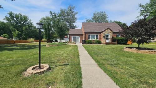a house with a street light in the grass at Urban Farmer House in Millman