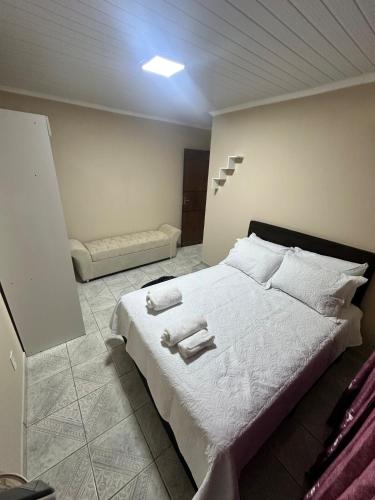 En eller flere senge i et værelse på Casa da Dona Rosa