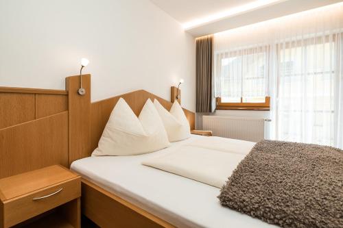 Apartments - Pension Florianにあるベッド