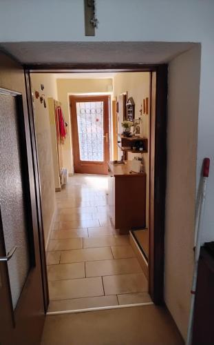 a view of a kitchen from the hallway of a house at Freddys Gästehaus mit 3 Schlafzimmer in Dellach