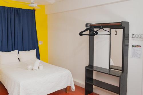 Ένα ή περισσότερα κρεβάτια σε δωμάτιο στο Hotel Doña Mary Huatulco