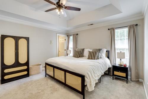a bedroom with a large bed and a ceiling fan at Playroom and Home Office Family Retreat in Mauldin! in Mauldin