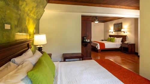 a hotel room with a bed and a bedroom at Tilajari Hotel Resort in Fortuna
