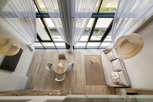 an overhead view of a living room with a large window at RIKKA KHUST thermal resort in Khust