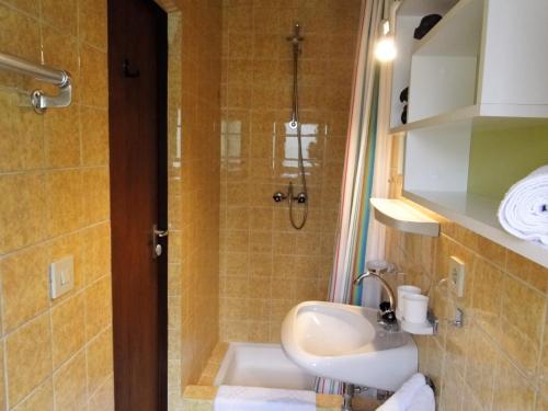 a bathroom with a sink and a shower at Landhaus Wörgartner in Going