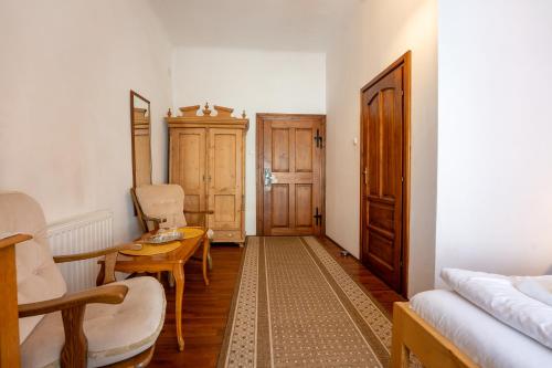 a living room with a couch and a table at Pensiunea Bastion - La Strada - in Sighişoara