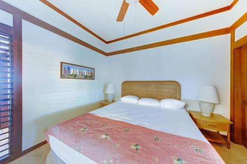 a bedroom with a bed and a ceiling at Kiahuna Plantation Resort Kauai by OUTRIGGER in Koloa