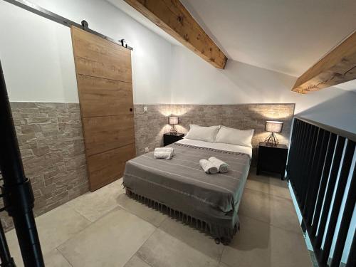 Ένα ή περισσότερα κρεβάτια σε δωμάτιο στο Le Relais de Sisco