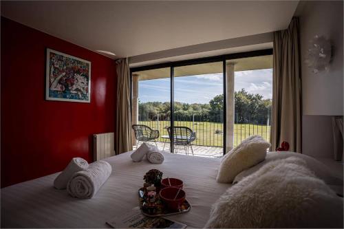 Ένα ή περισσότερα κρεβάτια σε δωμάτιο στο Villa Bellevue Vue Panoramique Flipper Billard