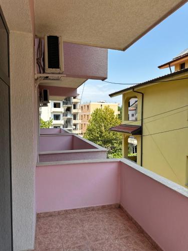 a balcony with a view of a building at Guest House Kalaja in Durrës