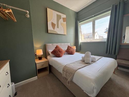 Ένα ή περισσότερα κρεβάτια σε δωμάτιο στο Three Palms Hotel