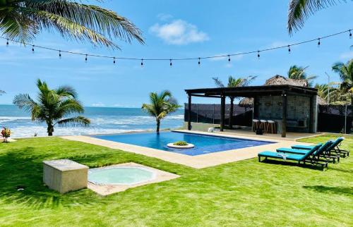 a backyard with a swimming pool and a gazebo at The sunrises are lovely, and the privacy is exceptional in Sipacate