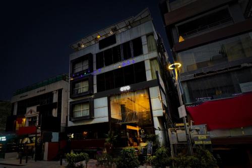 a building with a light on the side of it at Collection O 29 Church's Inn Near Cubbon Park in Bengaluru