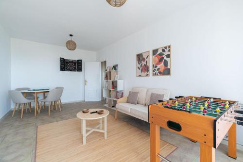 a living room with a chess table and a couch at Villa Cies con Piscina in Vigo