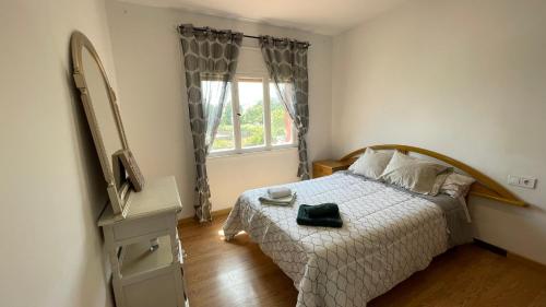 Ένα ή περισσότερα κρεβάτια σε δωμάτιο στο Apartamento céntrico