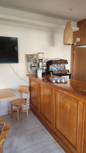 a kitchen with a wooden counter top with a refrigerator at Itzel in Picún Leufú