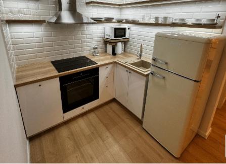 Η κουζίνα ή μικρή κουζίνα στο NOVERA Apartments - Galanda 24