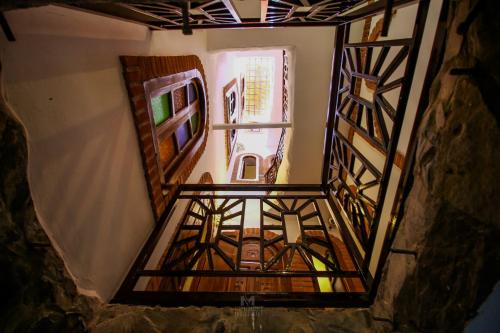 a view from the top of a room with a window at Riad Bab Mahrouk in Chefchaouene