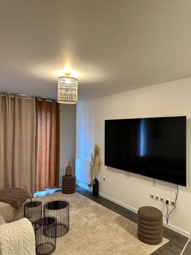 Μια τηλεόραση ή/και κέντρο ψυχαγωγίας στο Appartement luxueux avec jacuzzi