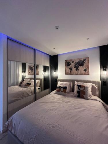 a large bedroom with two beds in it at Très bel appartement PremiumSteinbach-parking in Mulhouse