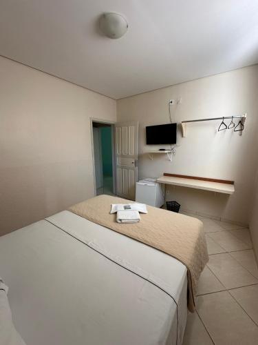 Katil atau katil-katil dalam bilik di Aruanã Palace Hotel