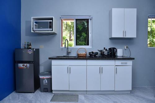 Una cocina o zona de cocina en LS Stonethrow - Sapphire Deluxe