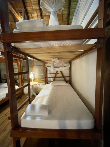 a couple of bunk beds in a room at La Perla Hostel and Cabins in Las Tunas