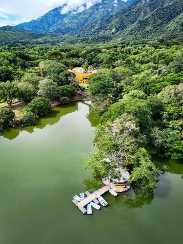 an aerial view of a lake with boats in it at Hostería Florida Tropical in Santa Fe de Antioquia