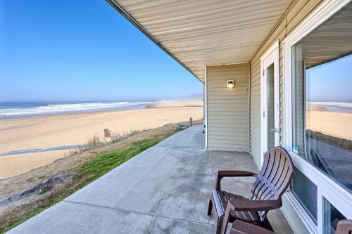 a porch with a bench and a view of the beach at Beachfront Condo - Ground Floor - Ocean Views - Pool & Hot Tub in Lincoln City